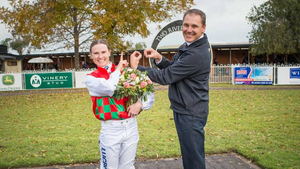 CONGRATULATIONS: Muswellbrook Race Club GM Duane Dowell presented Rachael Murray with a bunch of flowers after becoming the first female jockey to notch 100 NSW wins in a season. Pic: KATRINA PARTRIDGE PHOTOGRAPHY