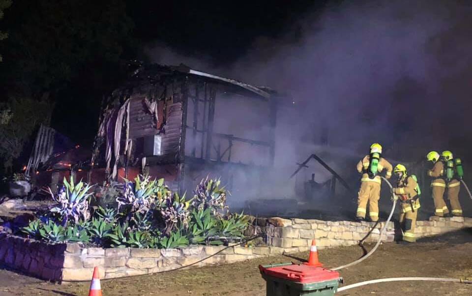 DESTROYED: Firefighters attempt to put out the Shaw Crescent house fire on Tuesday night. Pic: FIRE AND RESCUE NSW 392 MUSWELLBROOK 