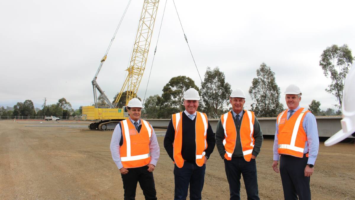Upper Hunter Shire mayor Wayne Bedggood, New England MP Barnaby Joyce, Upper Hunter MP Michael Johnsen and Upper Hunter Shire general manager Steve McDonald with the new concrete bridge girders ready to install on the Scone Bypass.