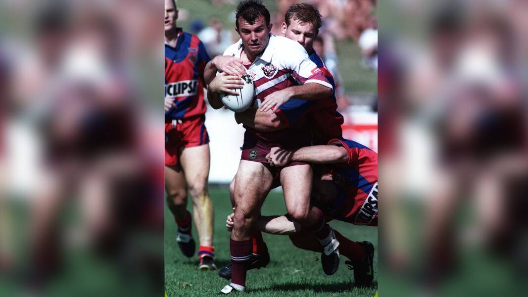 Craig Field being tackled during a Manly v Adelaide match at Brookvale Oval in 2006. Picture by AAP Image/Action Photographics, Robb Cox