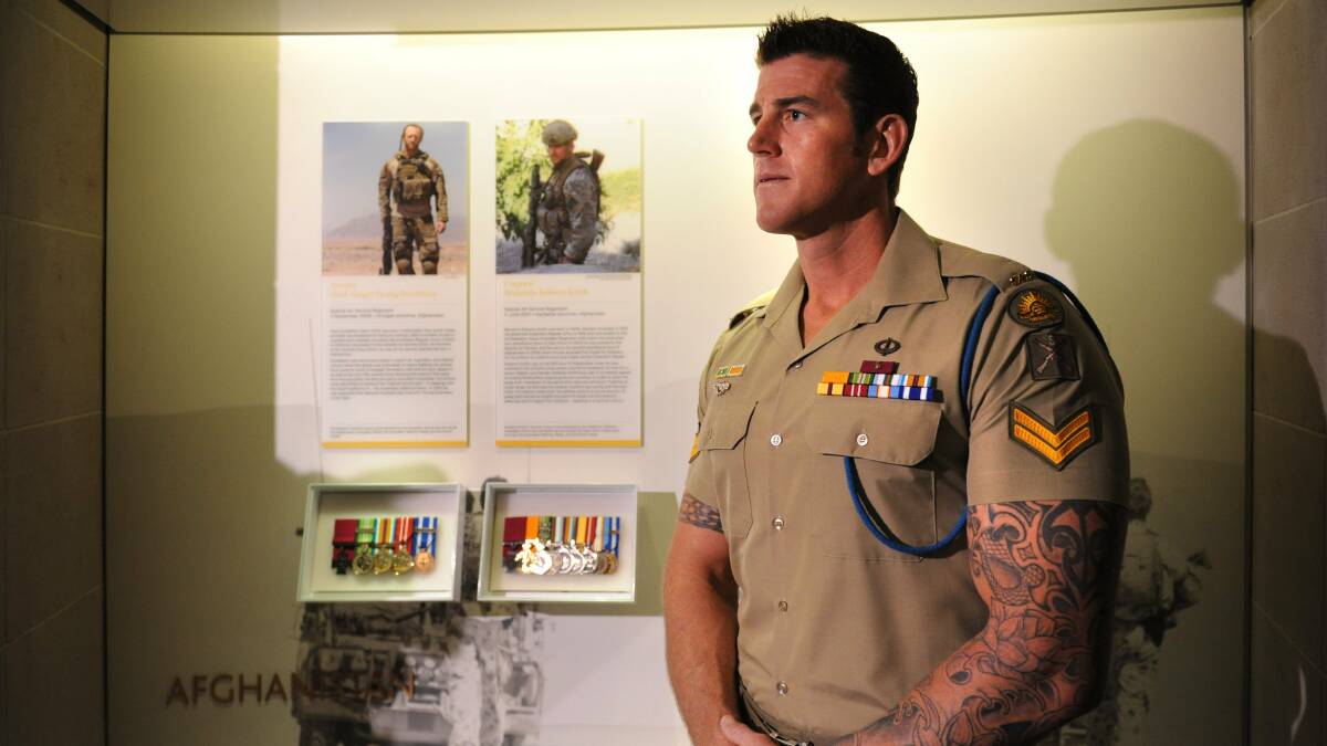 Victoria Cross recipient Ben Roberts-Smith, pictured next to his display at the Australian War Memorial in 2011. Picture by Marina Neil