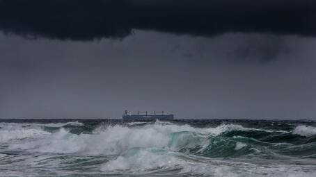 STORMY WATERS: A coal ship off the coast of Newcastle last week. The Grattan Institute says governments must get serious about planning for the consequences of net-zero targets. Picture: Marina Neil