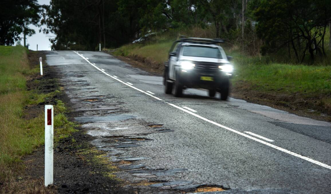 A potholed road near Wollombi. Many regional voters say their roads are not in an acceptable condition. Picture by Marina Neil