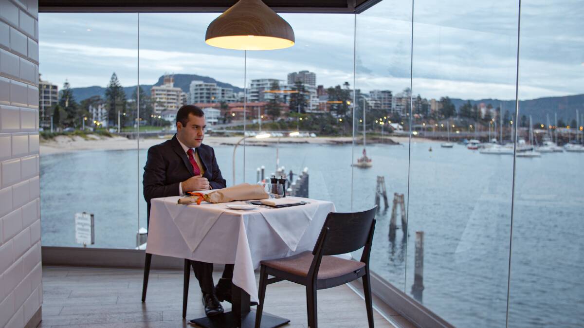 Love on the Spectrum: Michael Theo waiting for his first date at a Wollongong restaurant, in a scene from the documentary program. Picture: Supplied