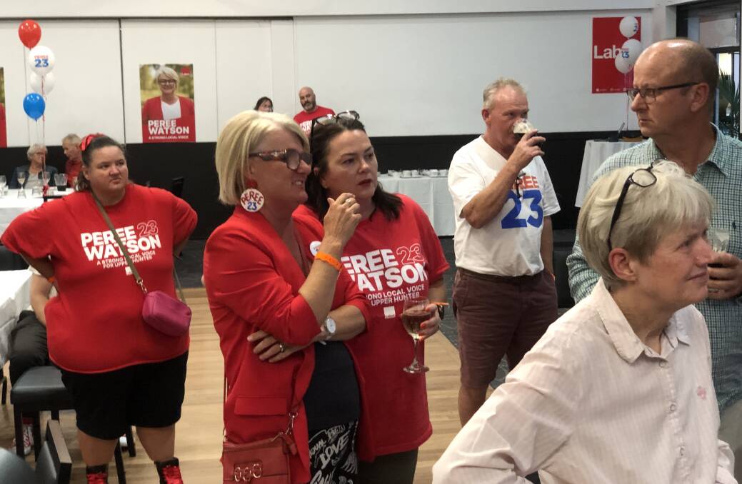 Labor's Peree Watson accesses the state of play with a supporter on Saturday night. Picture by Matthew Kelly