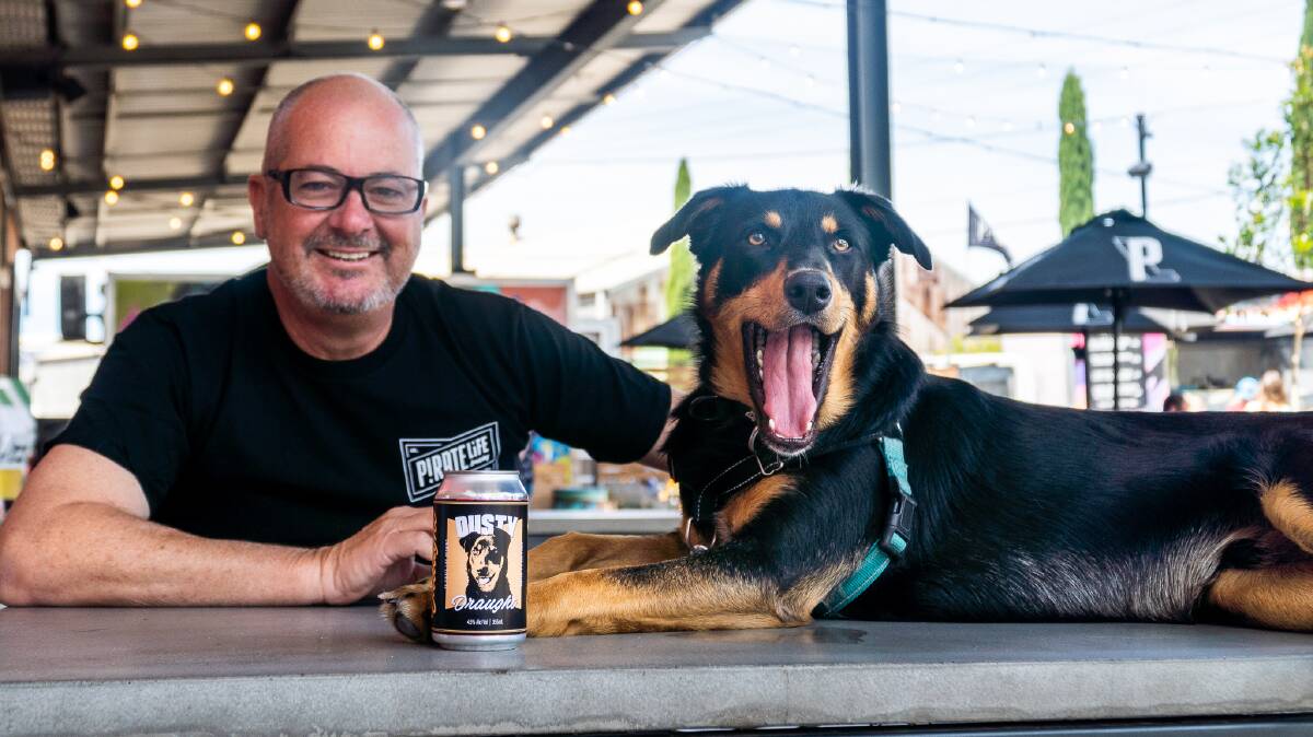 FARM FIRE DOG: Dusty the Kangaroo Island Kelpie with his owner Leon Bignell MP and the new Pirate Life Dusty Draught beer. Photo: Pirate Life 