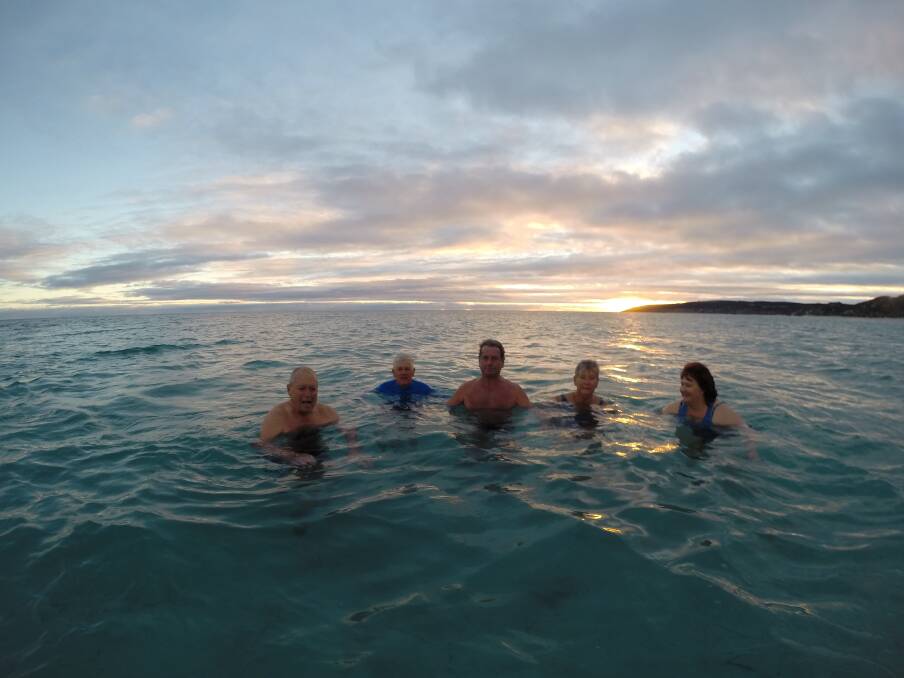 ISLAND ICICLES: Michael Amor, Graham Morris, Chris Black, Kirstin Svensson and Rebeka Turner in clear waters of Emu Bay on Sunday morning. Photo: Stan Gorton 