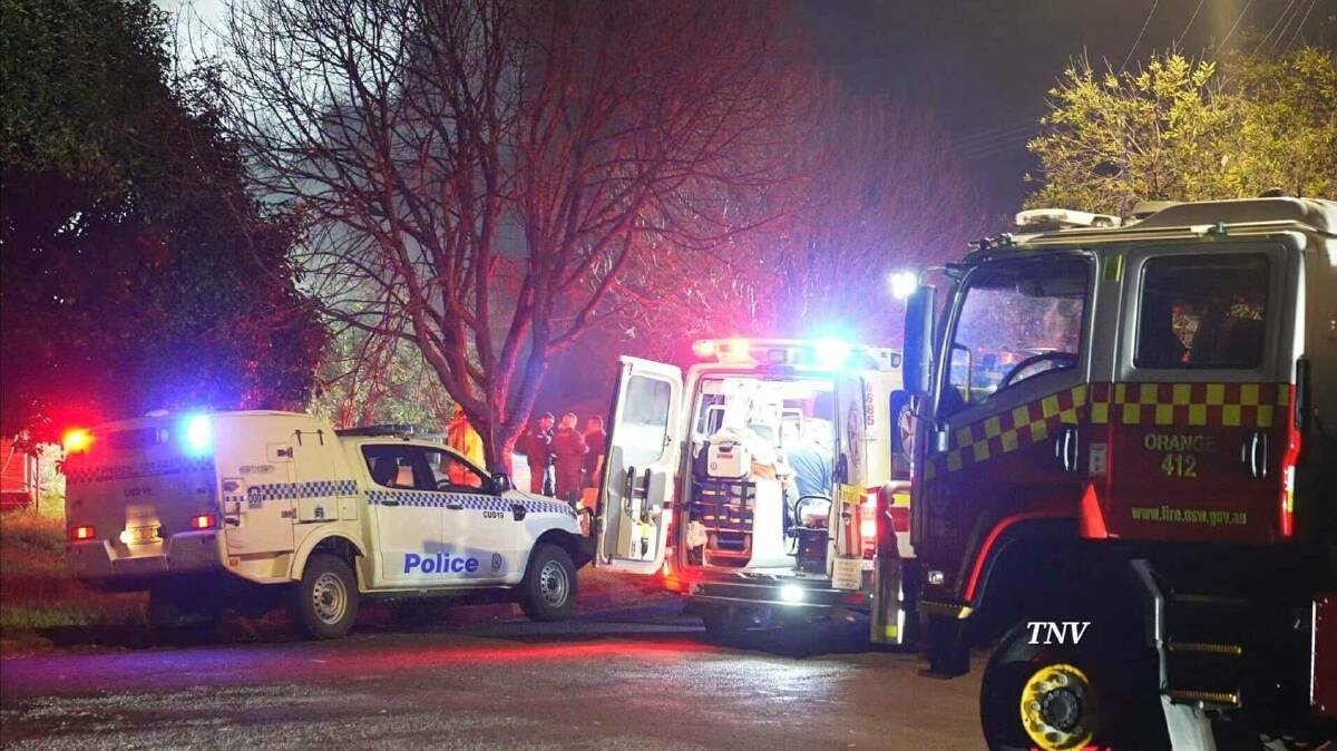 A picture of police, ambulance and fire trucks at Saturday morning's fatal house fire. Picture by Troy Pearson/TNV.
