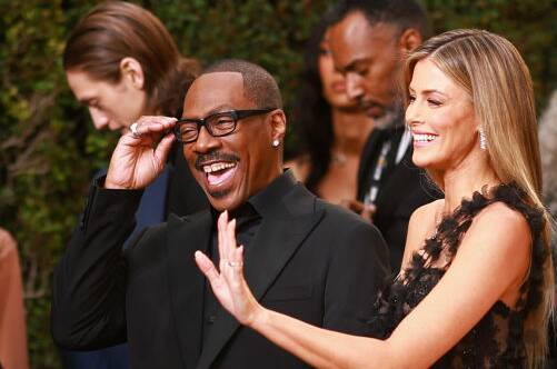 Eddie Murphy and Paige Butcher arrive at the ceremony. Picture Getty Images