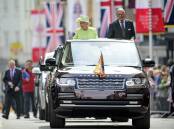 The Queen and Prince Philip in an open-topped Range Rover, on her 90th birthday. Picture supplied