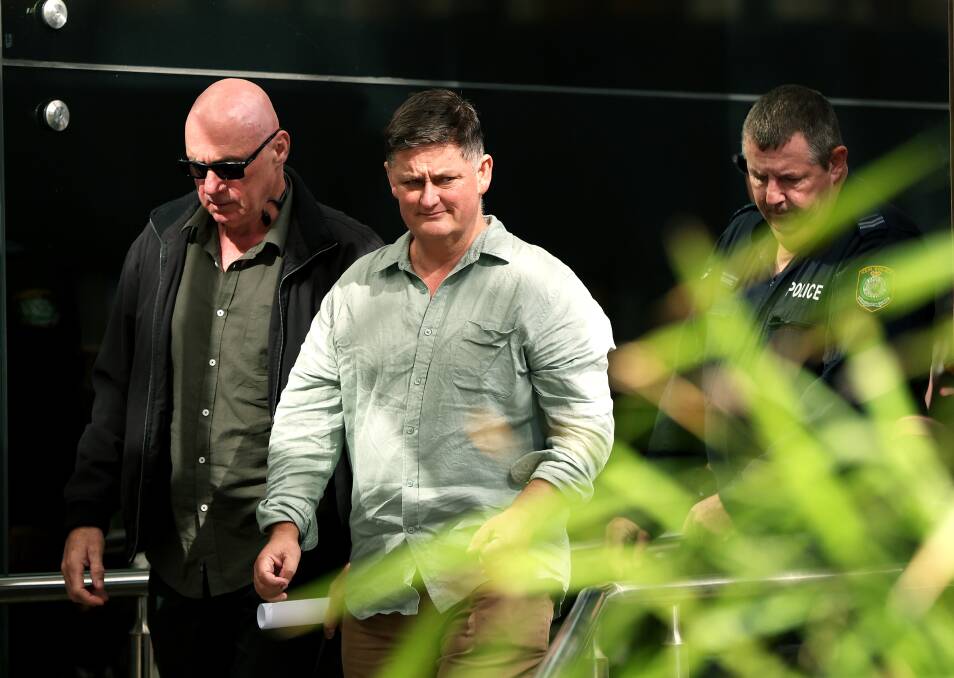 Graham McBride, who lost his wife and daughter Nadene and Kyah, and Matt Mullen, who lost his daughter Bec Mullen, leave Newcastle court on May 8. Picture by Peter Lorimer