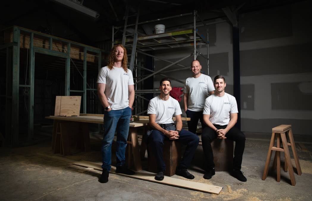 Works in progress: Michael Holt, seated in centre, with Jorden Jensen, Chad Russell and Luke Conners at the Junto Men's Hub. Picture: Marina Neil