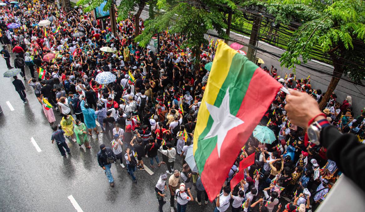 The flag of Myanmar flies above a protest against the country's military last year. Picture Getty Images 