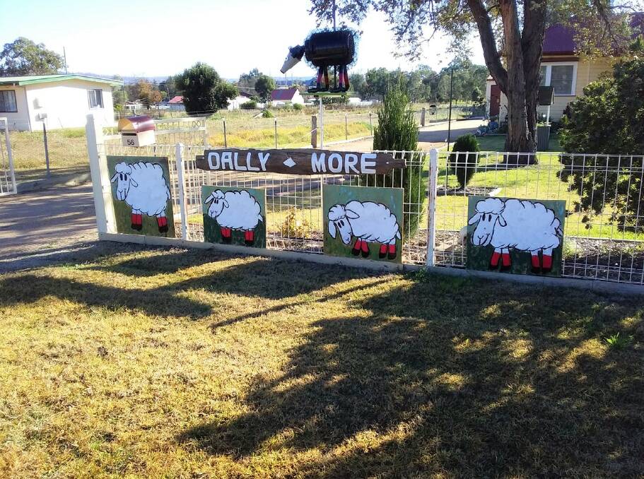 KEEP IT GOING: Cheryl Stuart's Merriwa home has been adorned with nine sheep to keep the festival spirit alive. 