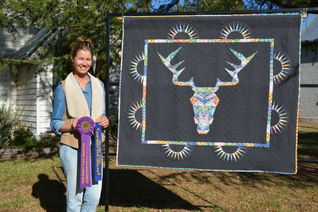 PASSION: Laura-Mae West with her Sydney Royal Show first prize winning piece "Stag" at the Murrurundi Historical Society. 