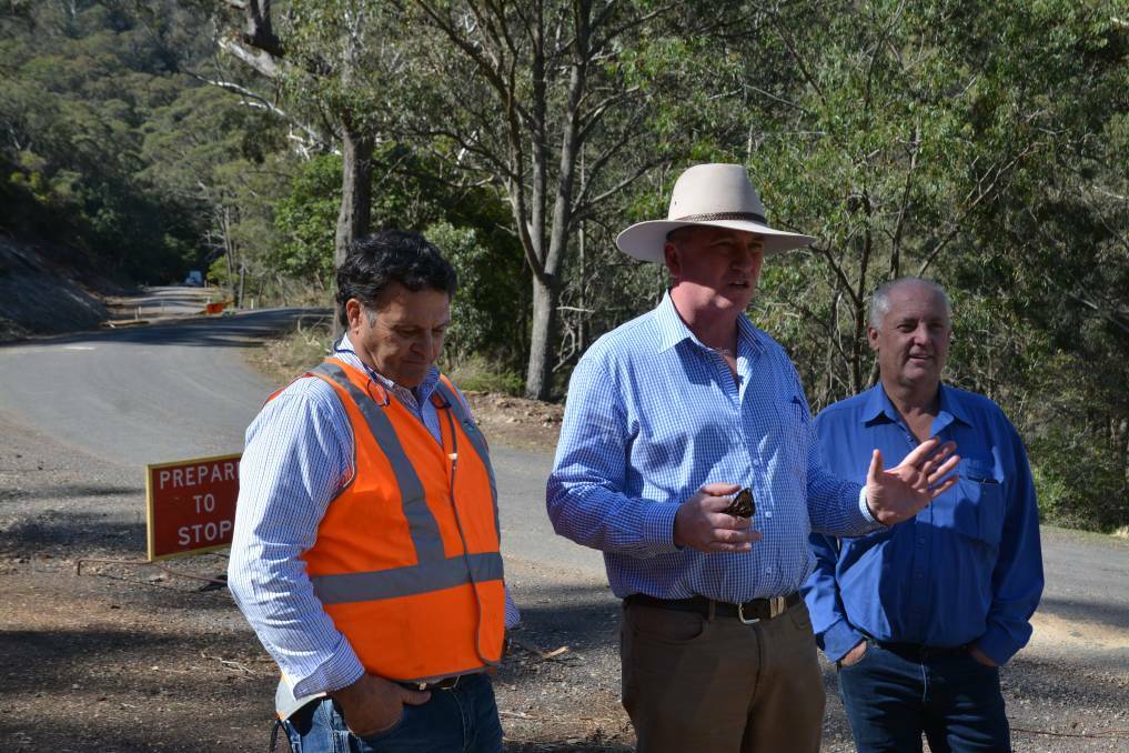 Former Upper Hunter Shire Council mayor Wayne Bedggood, New England MP Barnaby Joyce and Liverpool Plains Shire Council mayor Andrew Hope inspect the progress of the Merriwa to Willow Tree Road upgrade in October 2018. 