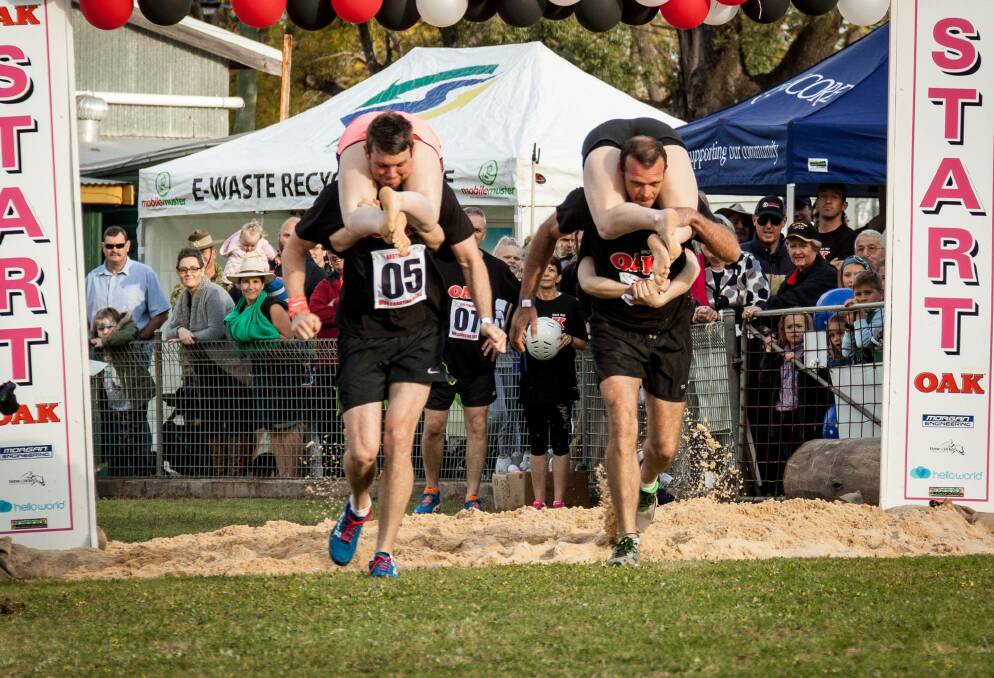 Forever focused: Last year's competitors at the Wife Carrying Championships had their heart on Finland as they lit up the Singleton Show. Pic: REBECCA CLARK