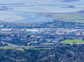 Fremont California, with Tesla's main factory across the middle of shot. Picture by Shutterstock