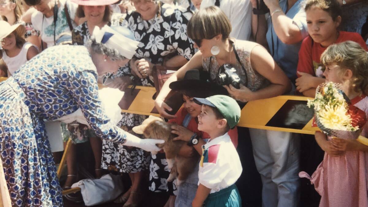 Kris Luzuriaga (now Stevens) with children Mo'Ju (then Monique) and Steven, Questa the corgi puppy, and Queen Elizabeth II during the 1992 visit to Dubbo. Picture supplied