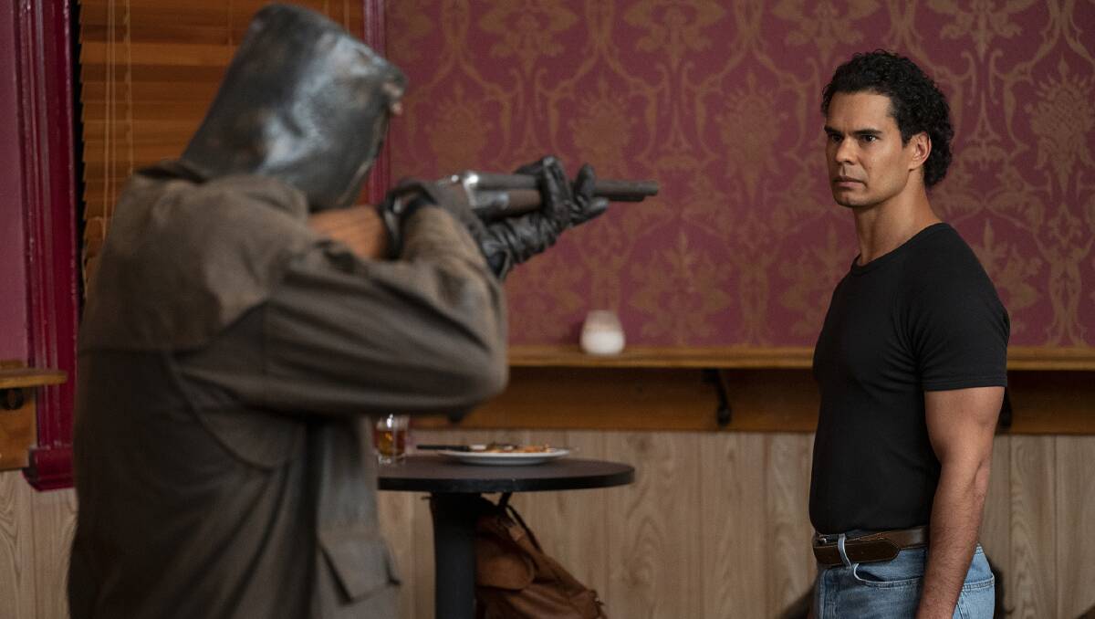 Mark Coles Smith as police office Jay Swan diffuses a desperate robbery in the local pub by a Ned Kelly masked man.