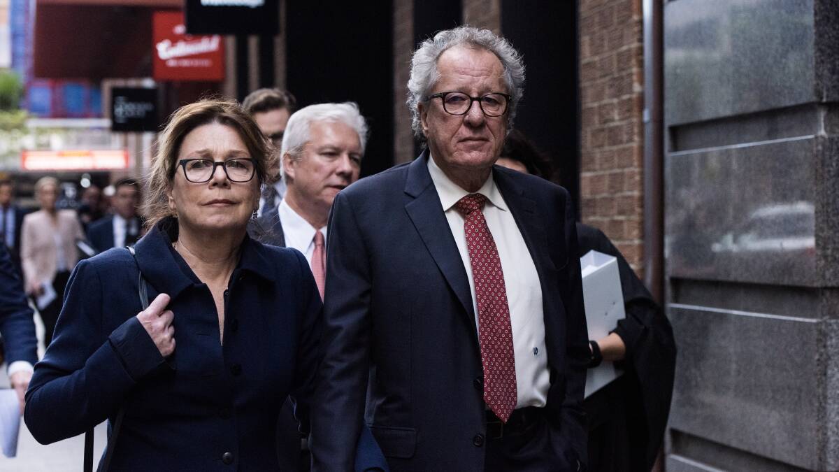 Geoffrey Rush and his wife Jane Menelaus leave the Federal Court in Sydney after his defamation win. Picture: James Brickwood