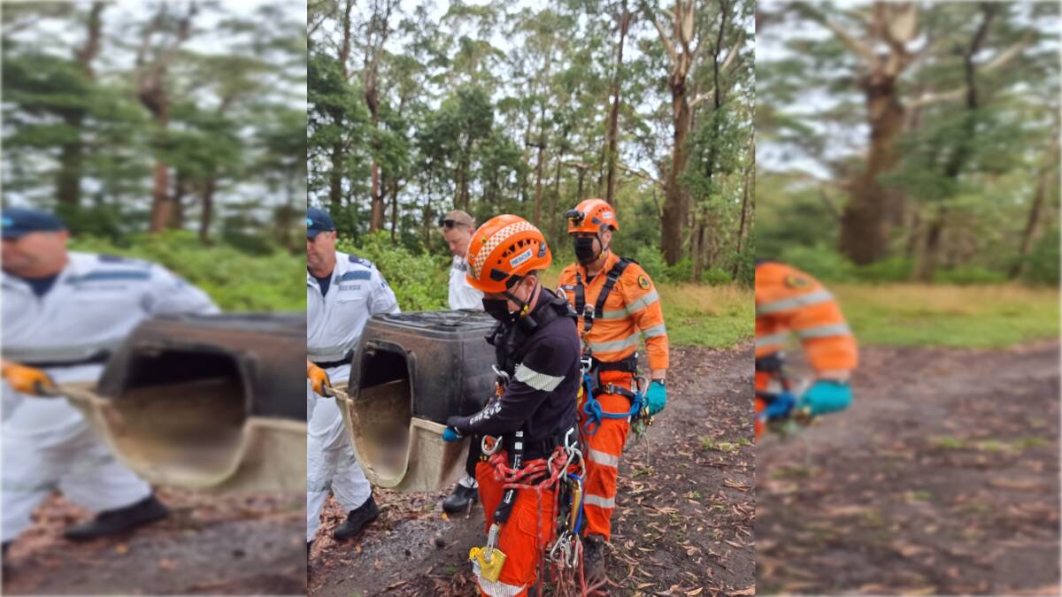 Rescue personnel with the kennel police believe was thrown from a cliff. Picture from NSW Police Force.