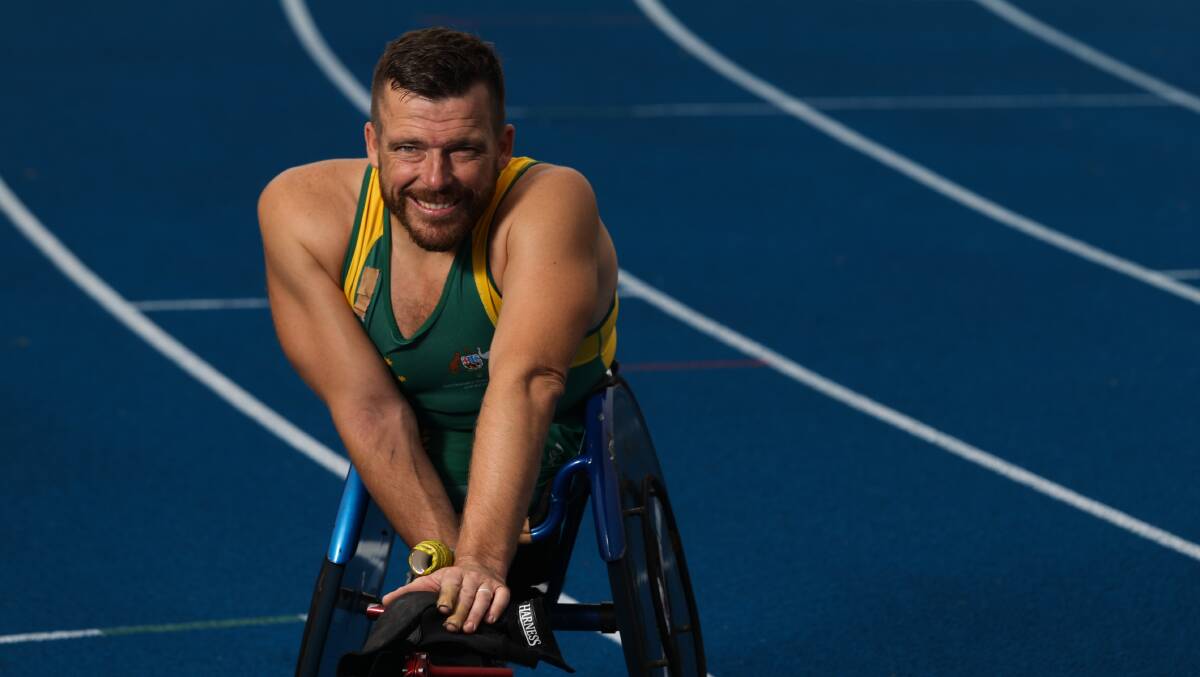 Newcastle Paralympian Kurt Fearnley training on the blue track before the Commonwealth Games. Picture by Jonathan Carroll.