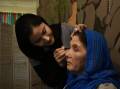 Shekofa Nieby putting makeup on Tahera at Zara's House, Ms Nieby runs tutorials for other Afghan refugee women each week. Pictures all by Simone De Peak.