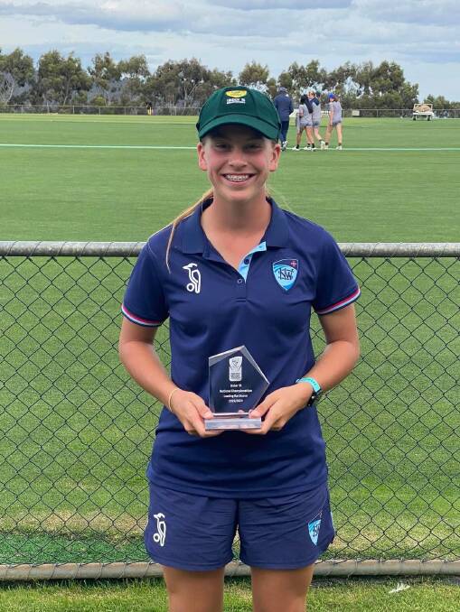 Caoimhe Bray with her batter of the tournament trophy at the conclusion of the Australian under-16 female cricket championships in Hobart on Thursday. Picture supplied