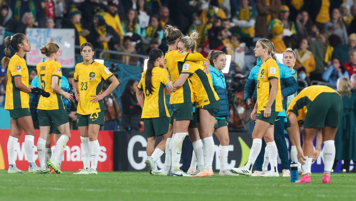 Matildas player Steph Catley and Ellie Carpenter share the pain of Wednesday night's semi-final loss to England at Stadium Australia. Picture by Adam McLean