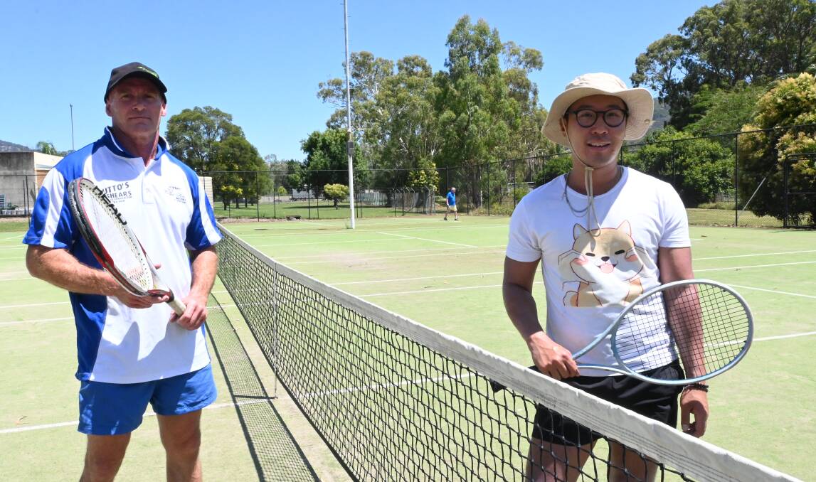 Murrurundi tennis talent Bart Bryce (left) shows city-slicker Thai Pham how it's done on the courts. Photo by Jess Wallace.
