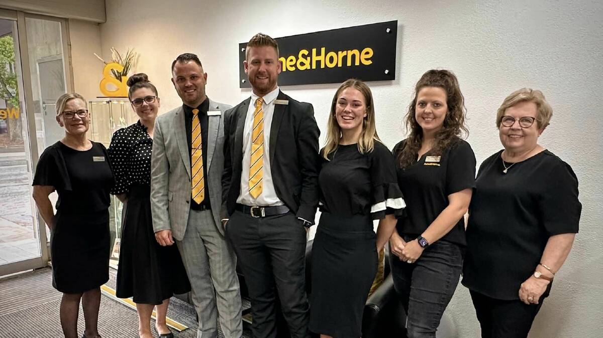 Grant and his team at Raine & Horne Muswellbrook. Photo supplied.