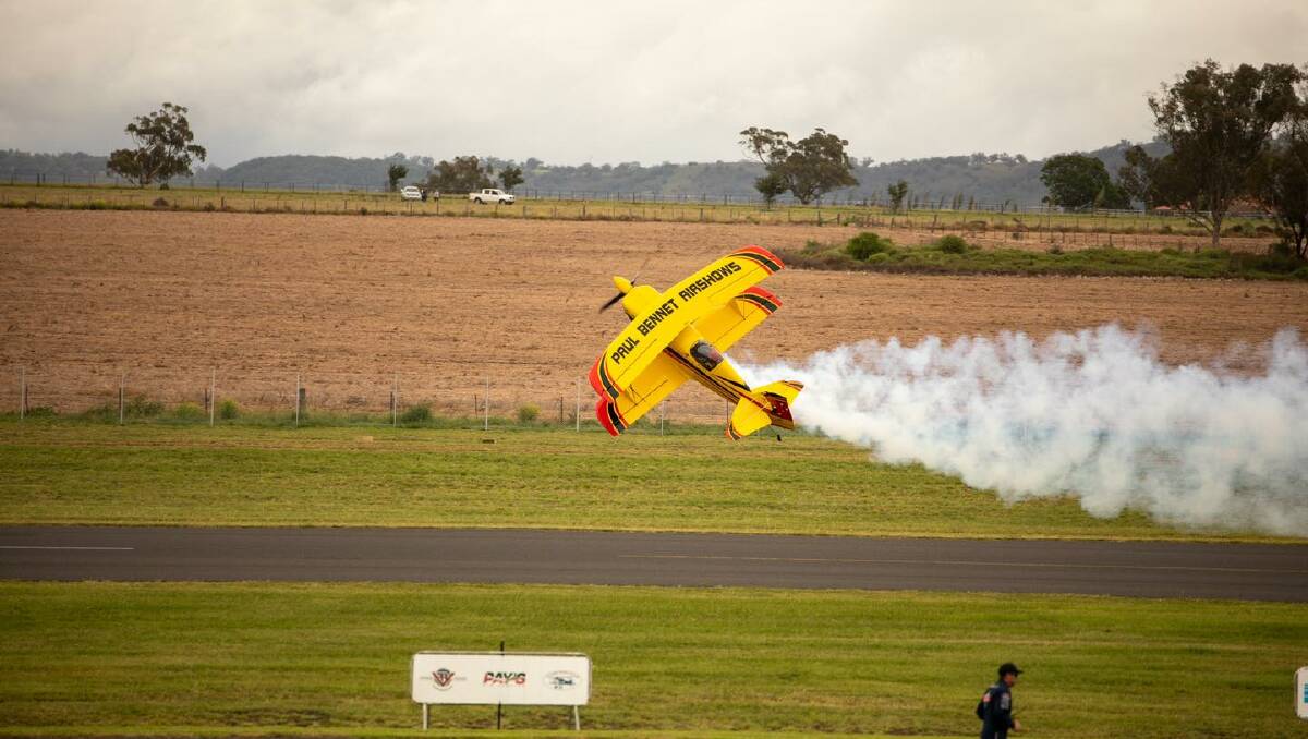 Paul Bennett flies just metres above the tarmac during an aerial stunt performance on March 26 at the Warbirds Over Scone event. Paul will be back for more jaw-dropping stunts at the Festival of Flight on Saturday, November 26. Picture: UHSC