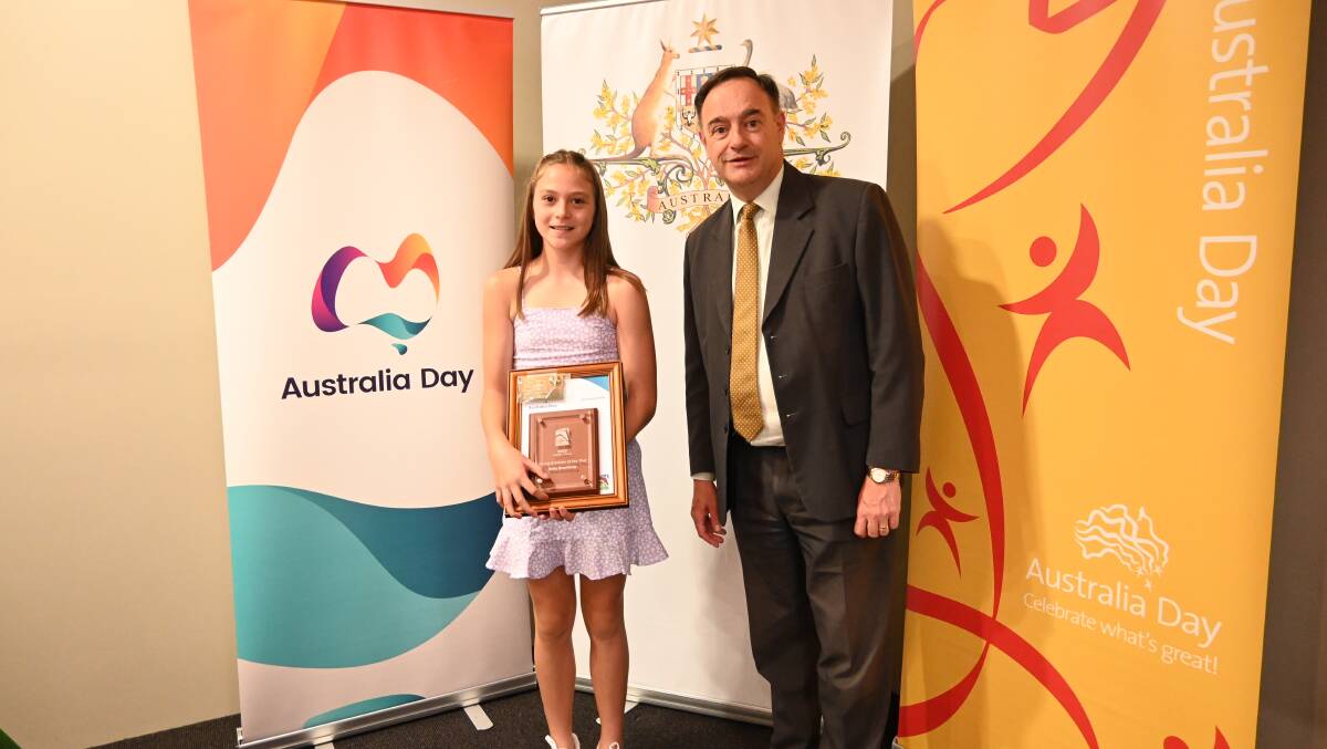 Ruby Brochtrup was named Aberdeen Young Achiever of the Year at the Upper Hunter Shire Council's Australia Day awards for 2023. Picture with general manager Greg McDonald. Picture by Jess Wallace.