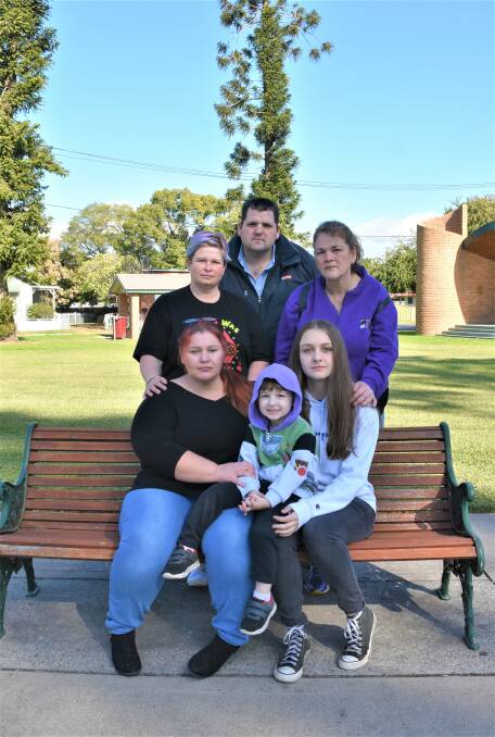 FAMILY STICK TOGETHER: Front row: Mary Franks, Hudson Towns and Alaura Fabian. Back row: Kasey Hoare, Adam McSweeney and Ann McSweeney stand together against racism. Photo: Julia Moore