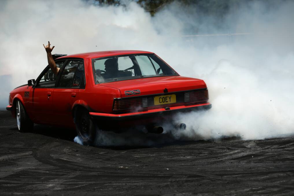 Spectators flocked to the fences to catch the display skids on the burnout pad.