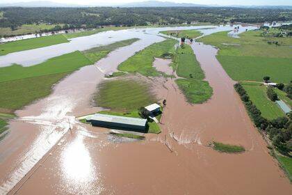 Michelle Bryant's home in Combo Lane, Singleton surrounded by water from the Hunter River on Wednesday, March 9. Picture: Jacob Merrick / Hunter Valley Photography & Videography