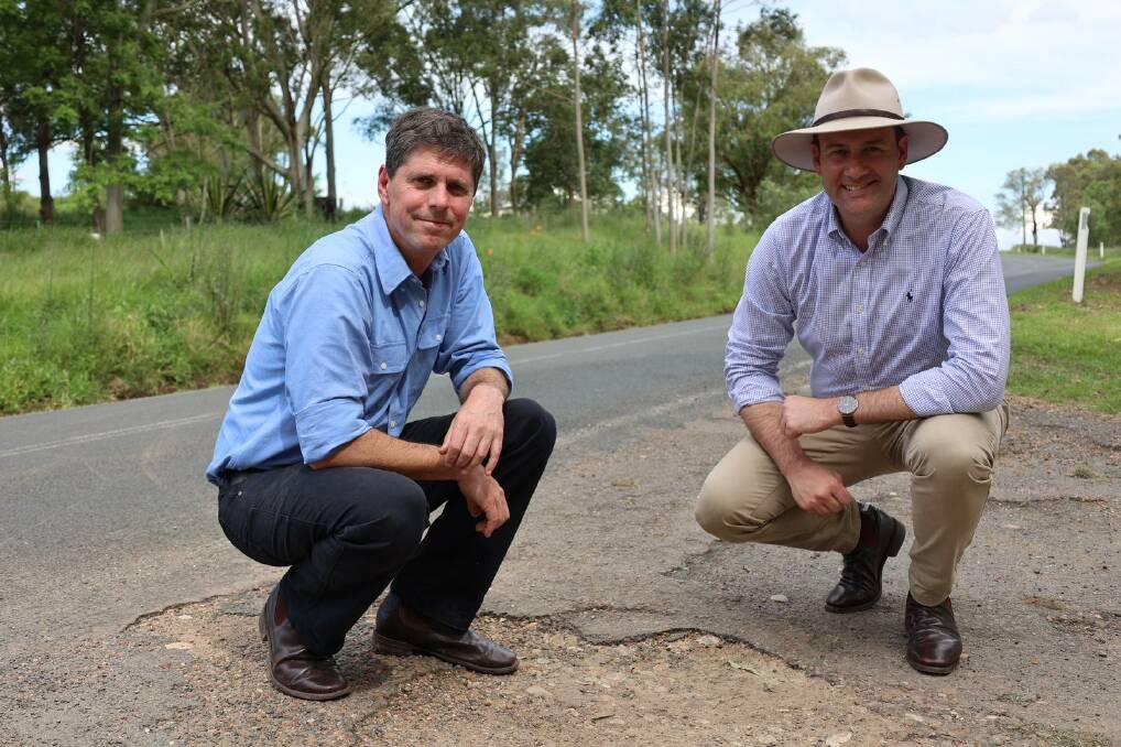 Dave Layzell and NSW Minister for Regional Transport and Roads Sam Farraway inspecting road damage