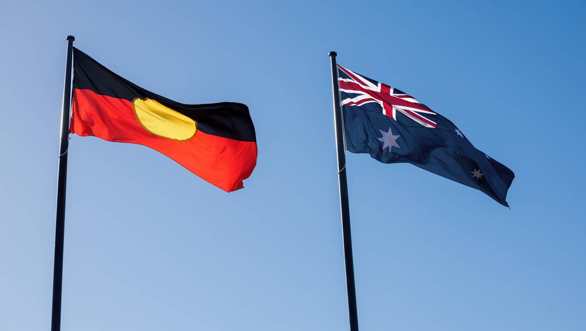 The Aboriginal and Australian flags. Picture by Sitthixay Ditthavong