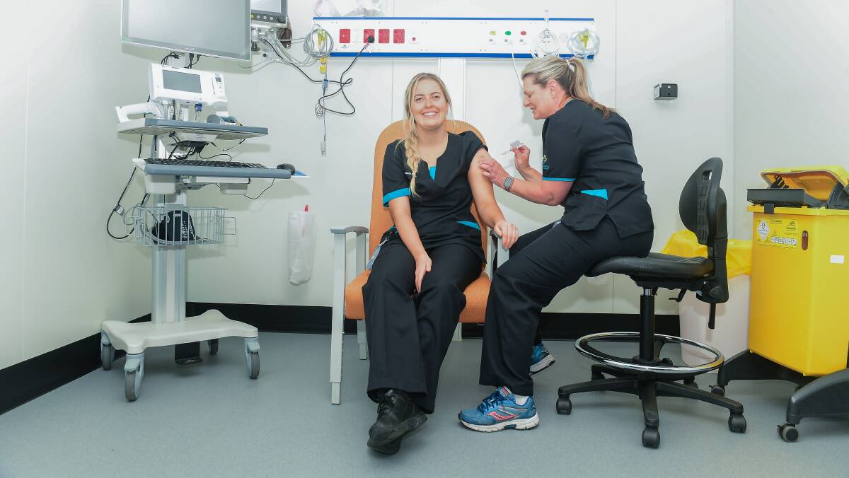 Nurse Maddy Williams getting a second dose of Pfizer. Picture: Karleen Minney Nurse Maddy Williams getting a second dose of Pfizer. Picture: Karleen Minney