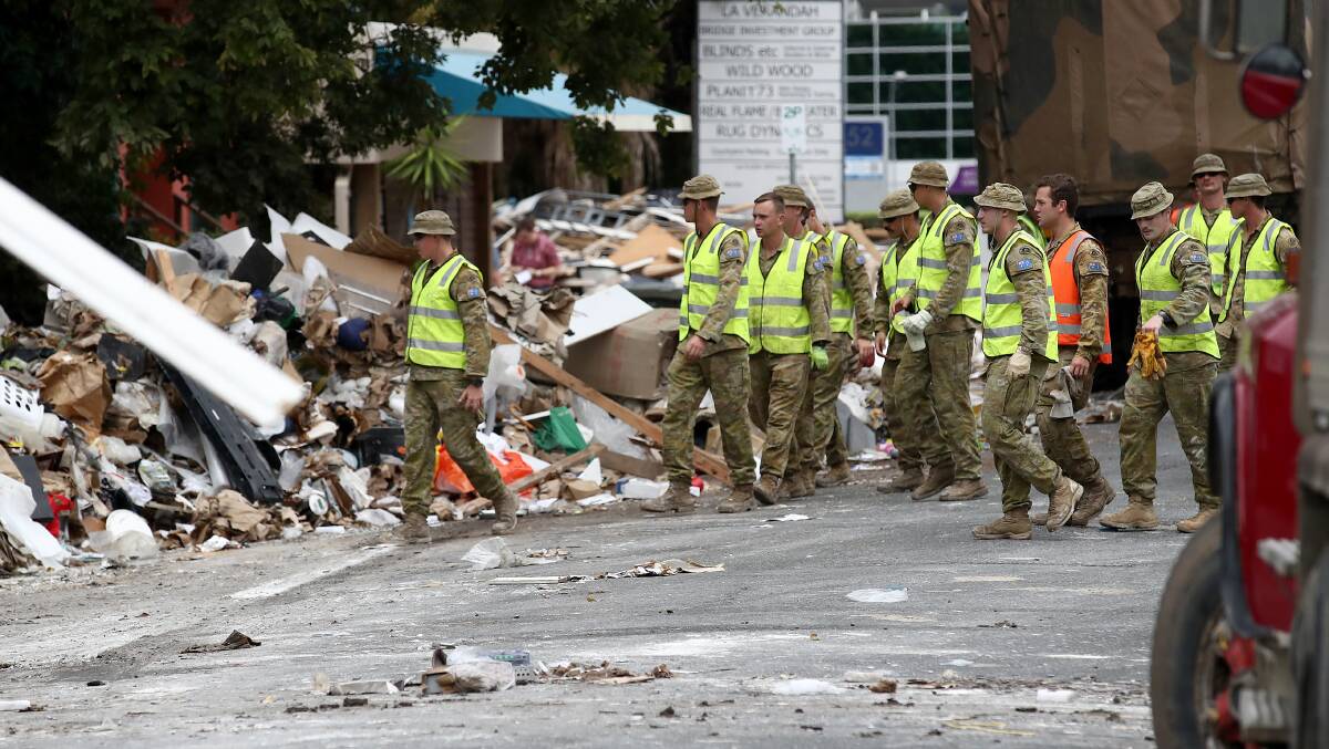 The Defence Force assisting with the clean-up following floods in south-east Queensland last year. Picture Getty Images