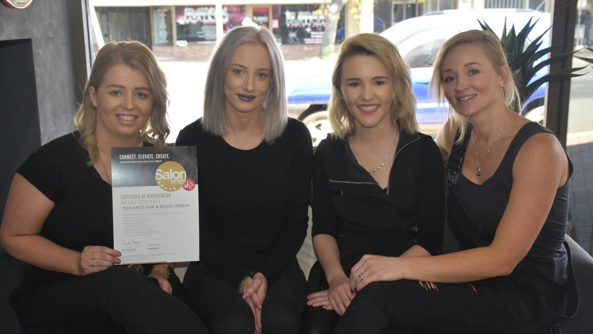 GOLDEN: Elegance Hair and Beauty's Maddy Barnes, Olivia Ward, Emily Winn, and Renee Burch with the certificate of Gold accreditation from AHC.