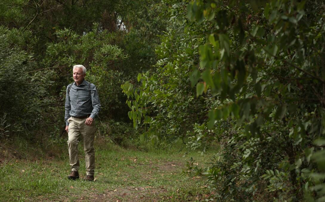 Brian Gilligan walking at the Awabakal Nature Reserve. Picture: Simone De Peak