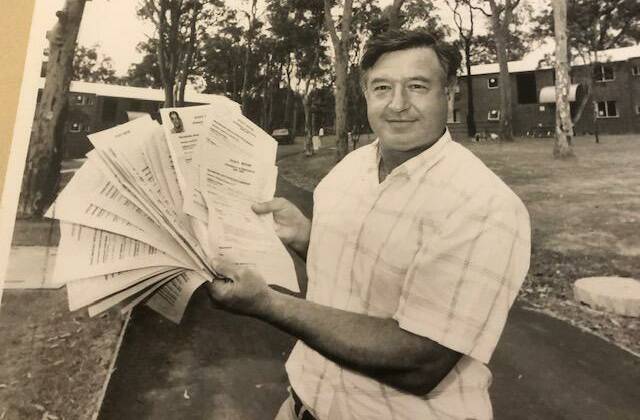 Bernie Curran holding applications from students for Evatt House in 1990. Picture: John Herbert 