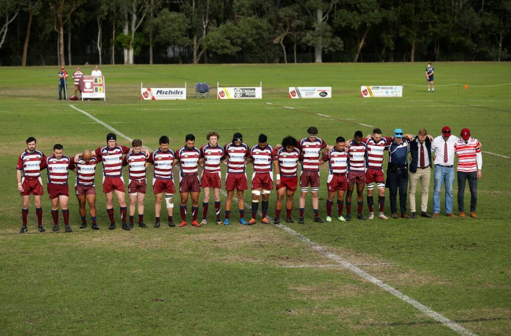 University of Newcastle Rugby Union Club's first grade team and officials line up as a tribute to Bernie Curran. Picture: Jonathan Carroll