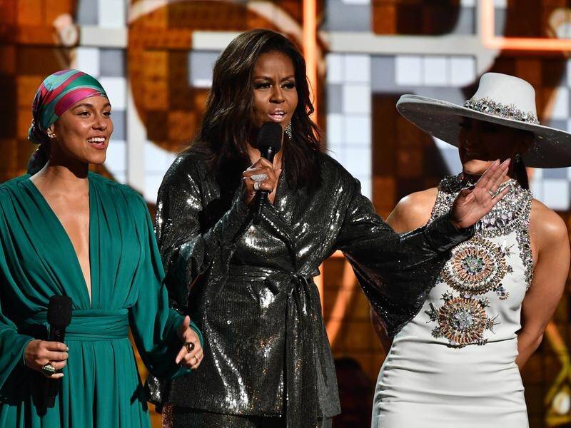 Michelle Obama received a standing ovation co-opening the Grammys but her mum was less enthusiastic.