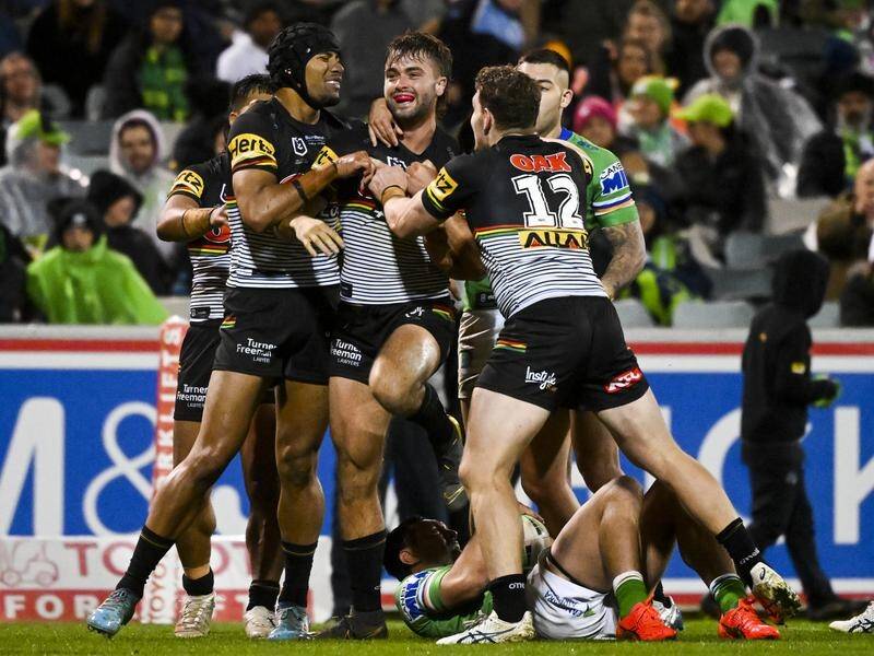 Penrith's Jaeman Salmon (c) celebrates during August's NRL clash with Canberra. (Lukas Coch/AAP PHOTOS)