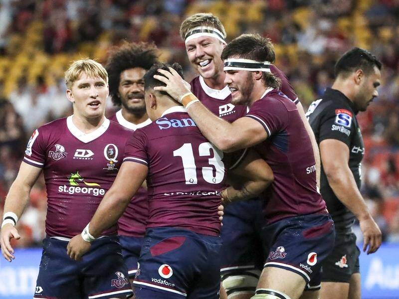 The Reds have celebrated their first Super Rugby win in 2020, a 64-5 thrashing of the Sunwolves.