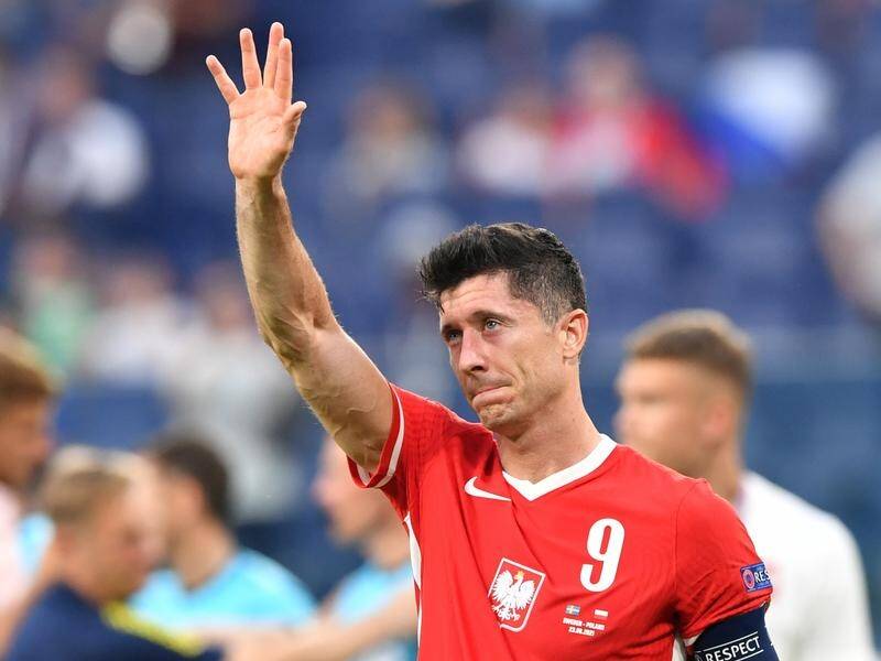 A crestfallen Robert Lewandowski salutes Poland's fans after they were knocked out of the Euros.