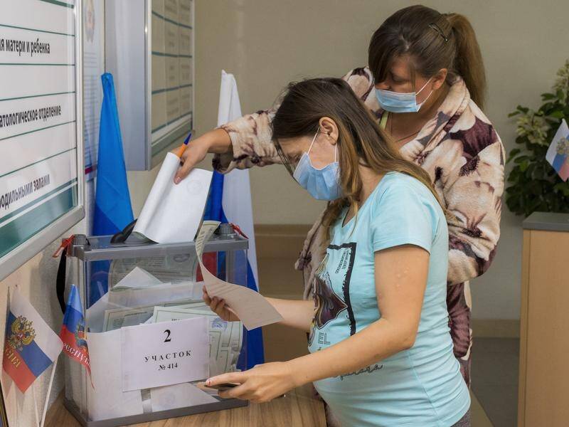 Voting is taking place in four occupied regions of Ukraine on referendums to become part of Russia. (AP PHOTO)
